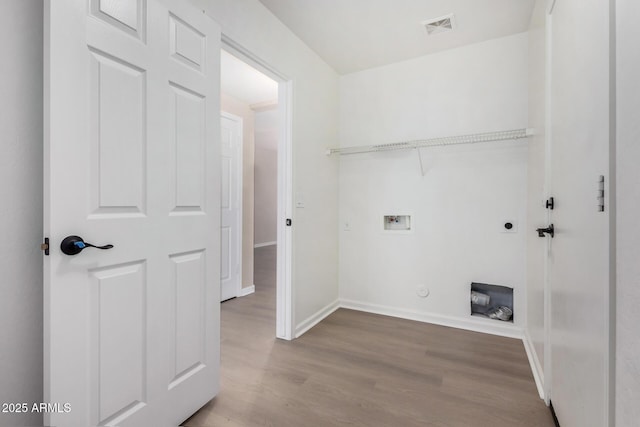 washroom with washer hookup, light wood-type flooring, and hookup for an electric dryer