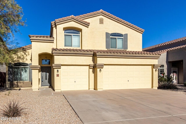 mediterranean / spanish-style house featuring a garage