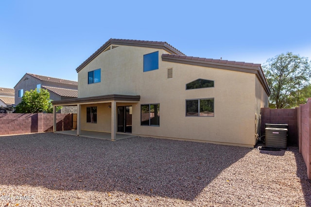 back of property featuring a patio and central air condition unit