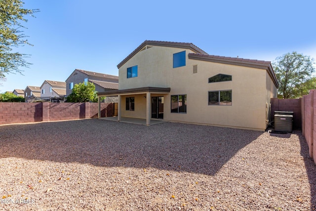 back of property with a patio area