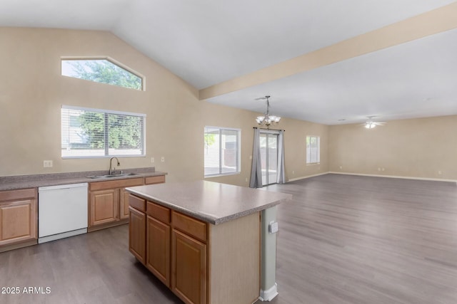 kitchen featuring a center island, white dishwasher, sink, light hardwood / wood-style flooring, and decorative light fixtures