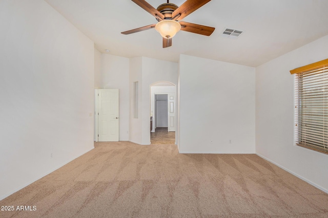 carpeted empty room featuring ceiling fan