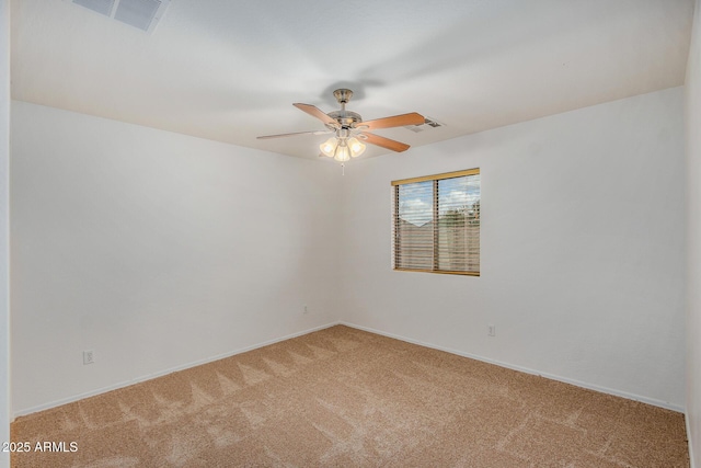 spare room featuring carpet flooring and ceiling fan