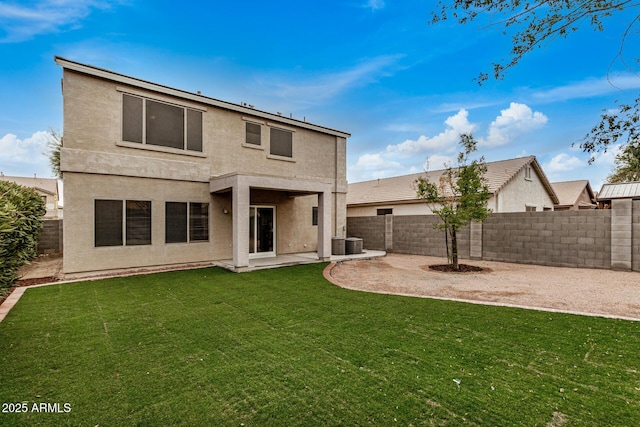 rear view of property with a patio, central AC unit, and a lawn