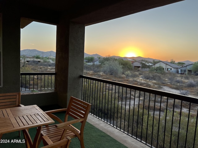 balcony at dusk with a mountain view