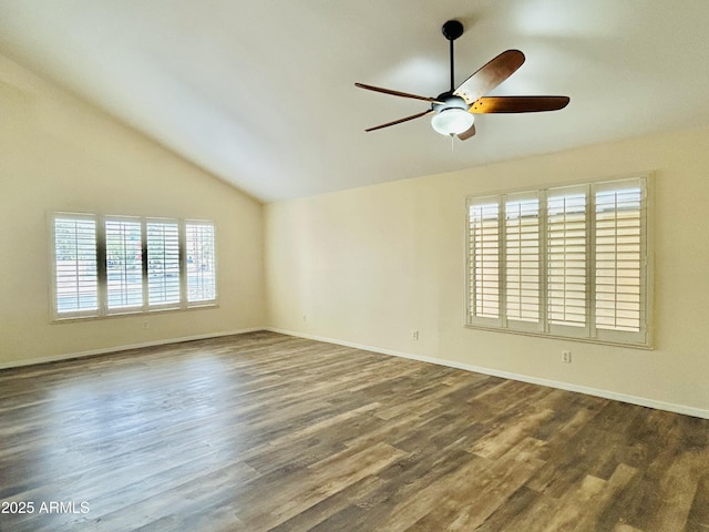 empty room with dark wood-style floors, baseboards, lofted ceiling, and a ceiling fan