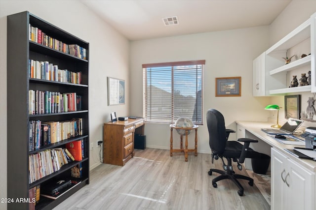 office area with light hardwood / wood-style floors