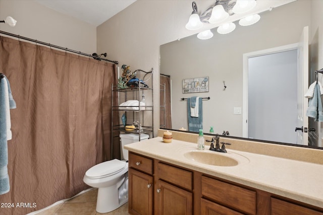 bathroom featuring toilet, vanity, and tile patterned floors