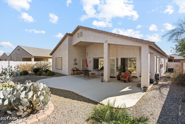 rear view of house with a patio