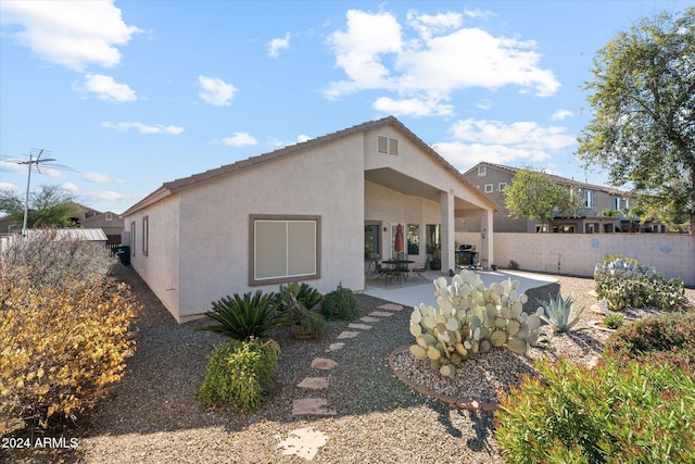 rear view of house with a patio