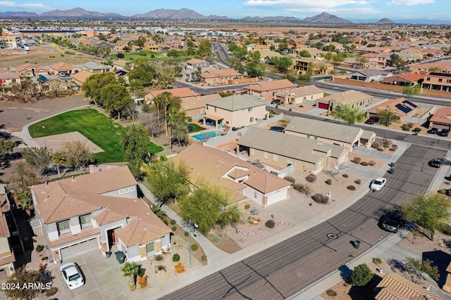 birds eye view of property featuring a mountain view