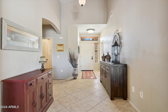 entryway with light tile patterned floors