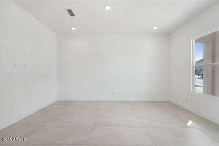 unfurnished room featuring recessed lighting, visible vents, baseboards, and light tile patterned flooring