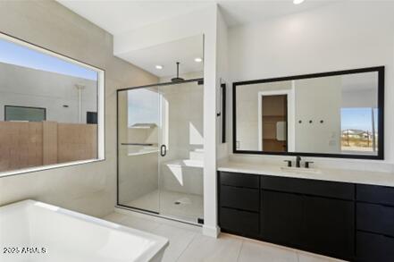 bathroom with vanity, a bathing tub, recessed lighting, a stall shower, and tile patterned flooring