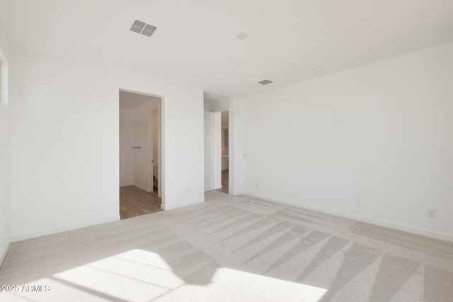 unfurnished bedroom with light colored carpet