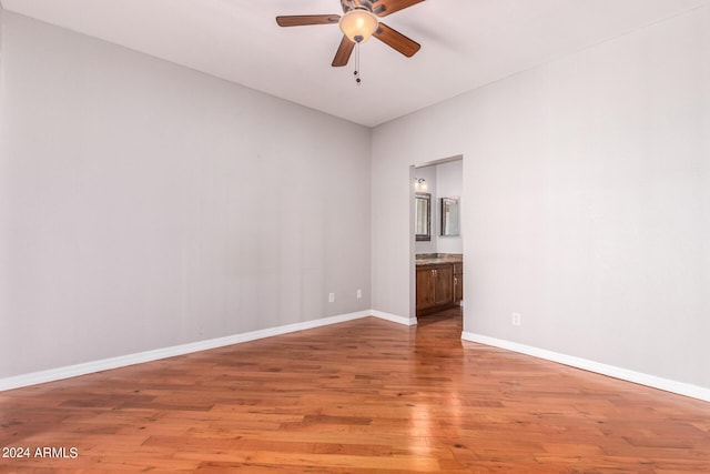 spare room featuring ceiling fan and light wood-type flooring