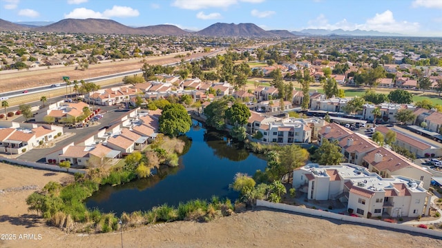 drone / aerial view with a water and mountain view