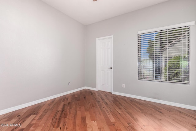 empty room with hardwood / wood-style floors