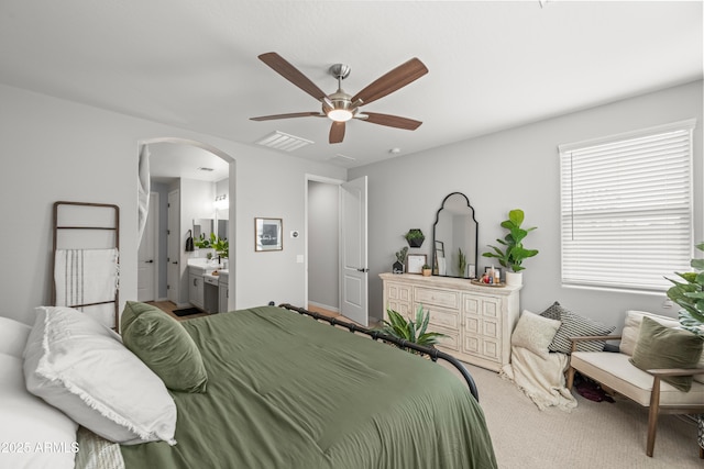 3505 W Verde River Rd, San Tan Valley, AZ 85144 - bedroom with carpet flooring, ensuite bath, visible vents, ceiling fan, and arched walkways