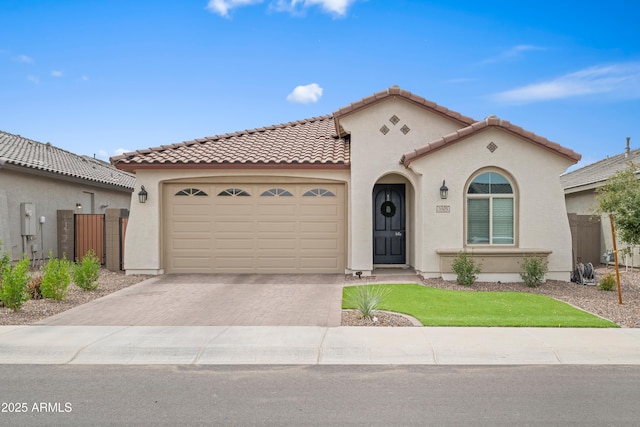 3505 W Verde River Rd, San Tan Valley, AZ 85144 - mediterranean / spanish house with a tiled roof, an attached garage, stucco siding, a gate, and driveway