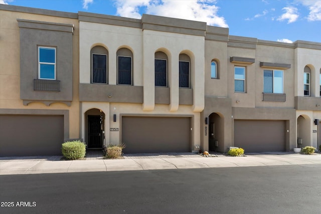 multi unit property featuring a garage