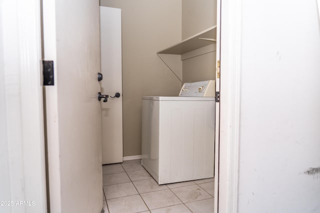 washroom with light tile patterned floors and washer / dryer