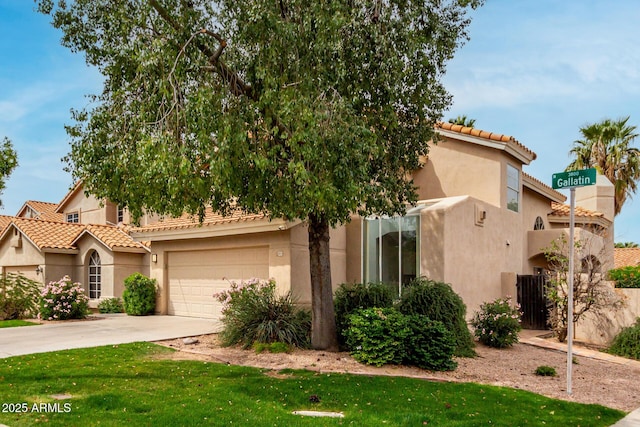 3832 N Gallatin, Mesa, AZ 85215 - view of front of house featuring a tiled roof, driveway, stucco siding, and a front lawn