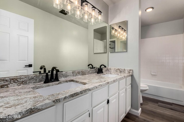 3832 N Gallatin, Mesa, AZ 85215 - bathroom with toilet, a sink, double vanity, and wood finished floors