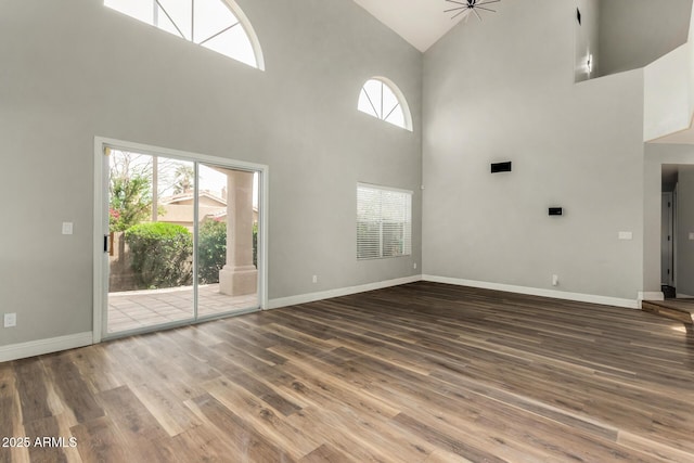 3832 N Gallatin, Mesa, AZ 85215 - unfurnished living room with baseboards, wood finished floors, and a healthy amount of sunlight