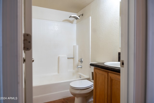 full bathroom with vanity, bathing tub / shower combination, toilet, and tile patterned floors