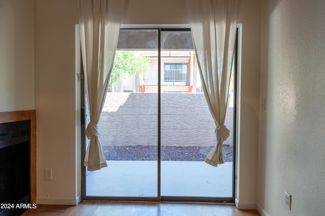 doorway to outside featuring light hardwood / wood-style floors