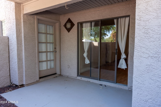 property entrance with a patio area