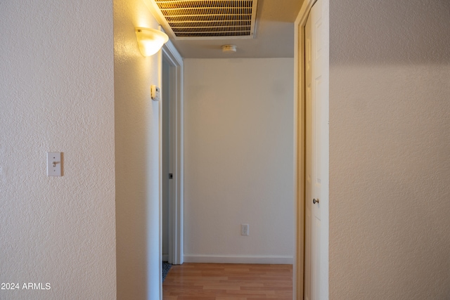 corridor featuring light hardwood / wood-style flooring