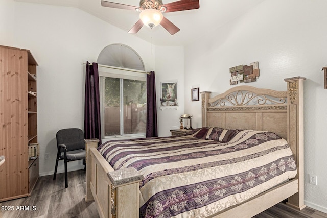 bedroom with baseboards, lofted ceiling, ceiling fan, and dark wood-style flooring