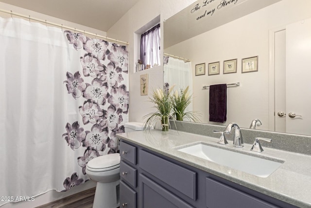 full bathroom with a shower with curtain, toilet, wood finished floors, and vanity