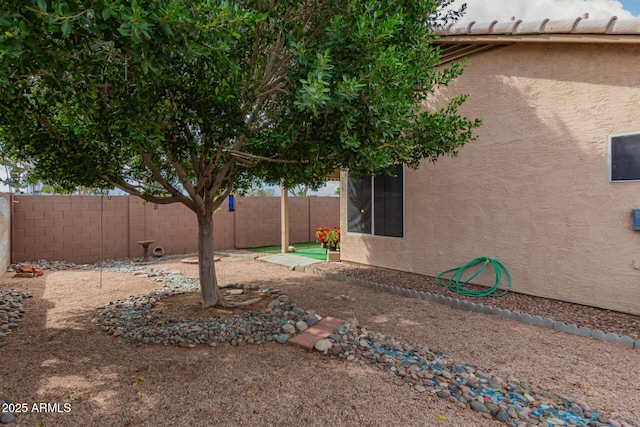 view of yard featuring a patio and a fenced backyard