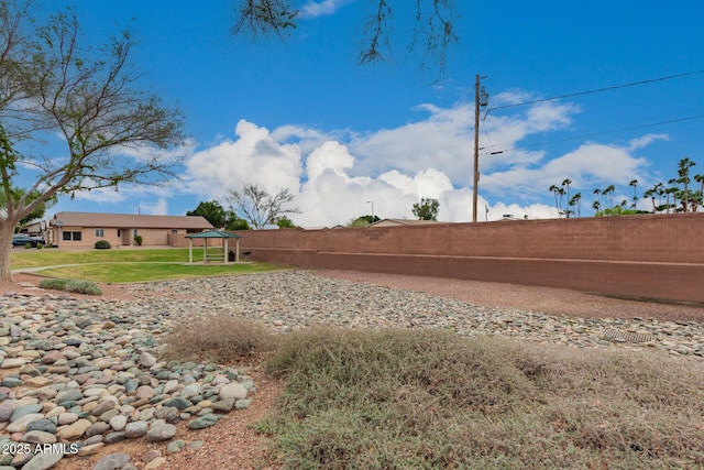 view of yard with a fenced backyard