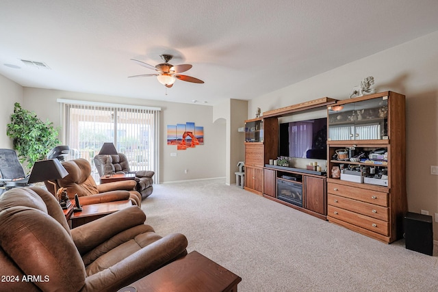 living room with carpet floors and ceiling fan