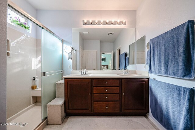 bathroom with vanity and an enclosed shower