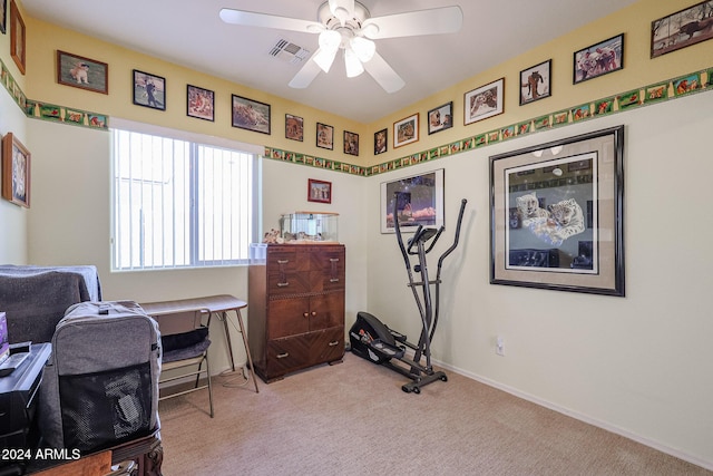 carpeted office with ceiling fan