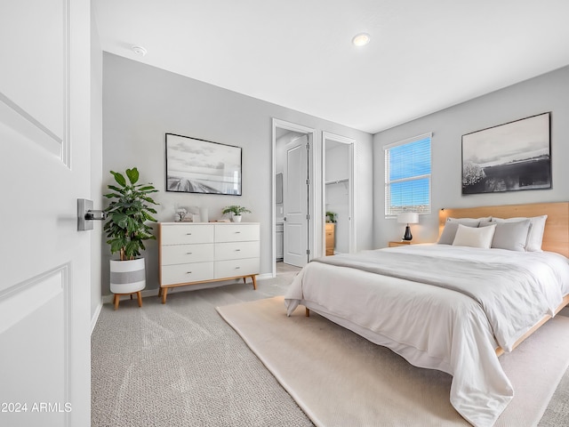 bedroom featuring light colored carpet