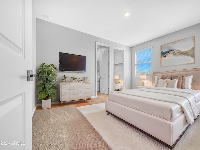 bedroom with light hardwood / wood-style flooring