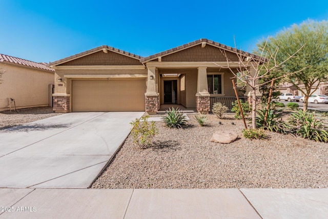 craftsman-style home with stone siding, a porch, driveway, and stucco siding