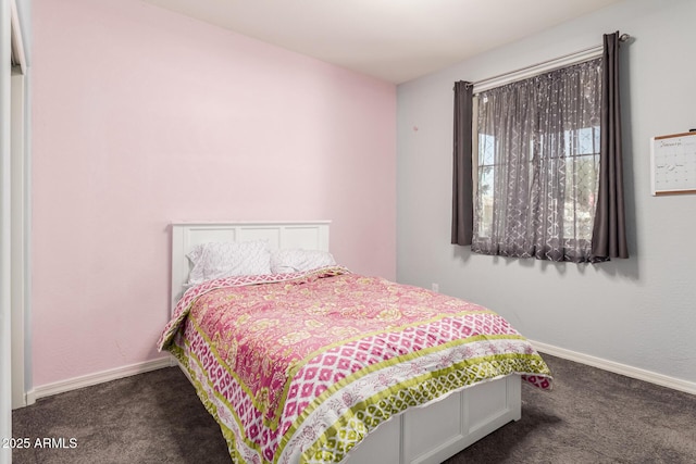 bedroom with carpet flooring and baseboards