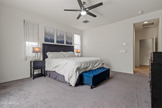bedroom featuring carpet, visible vents, and baseboards