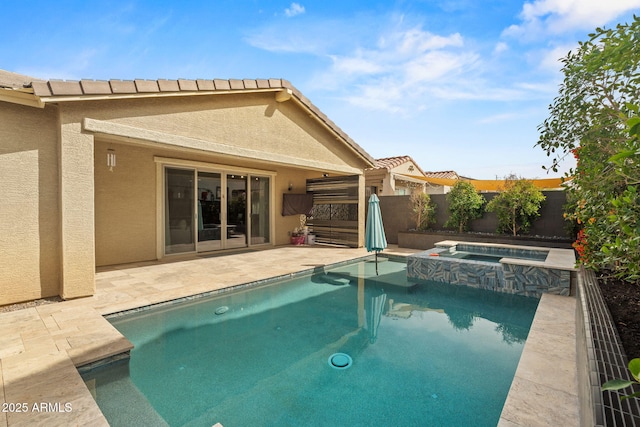 view of pool with a patio area, a fenced backyard, and a pool with connected hot tub