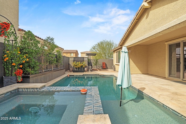 view of swimming pool featuring a patio area, a fenced backyard, and a fenced in pool