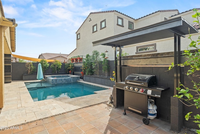 view of swimming pool featuring a patio area, a fenced backyard, a pool with connected hot tub, and grilling area