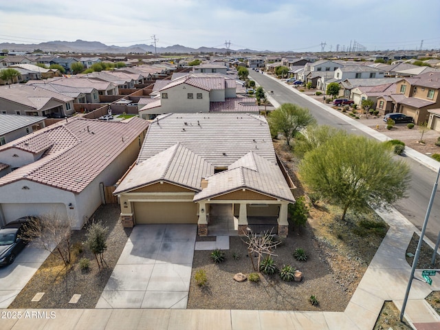 bird's eye view featuring a residential view and a mountain view