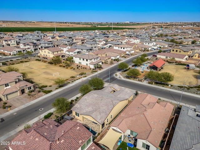 birds eye view of property with a residential view